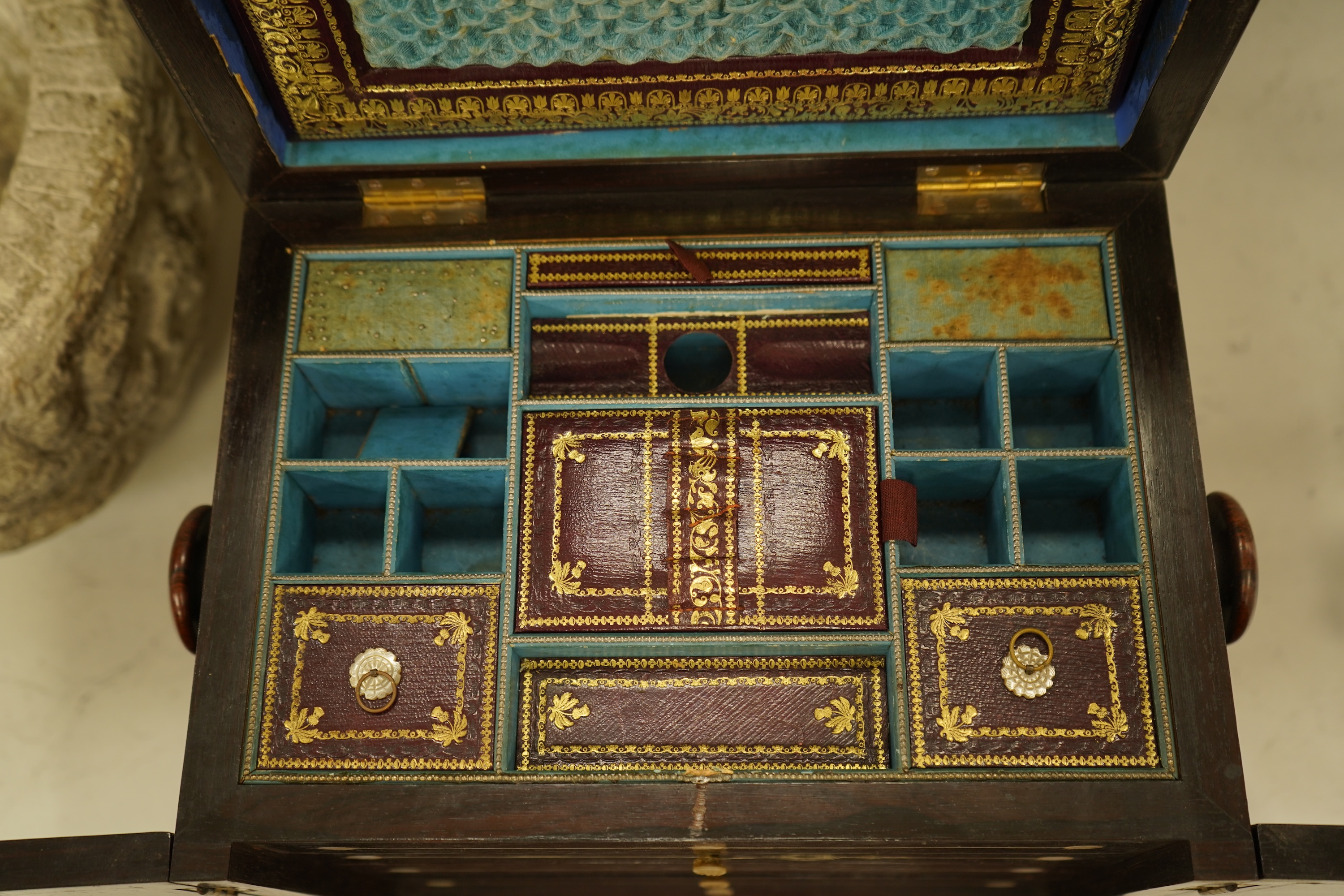 A William IV rosewood and mother of pearl inlaid sewing and writing cabinet with tooled Moroccan leather fitted interior, 37cm high
